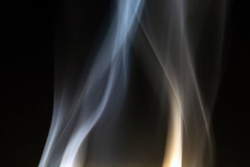 Obraz premium floating, defocused smoke on a black background