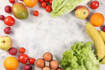 Tropical fruits, grapefruit, orange, lemon on a concrete background, healthy food, summer banner. The concept of minimal relaxation, detox diet. Place for text, flat lay.