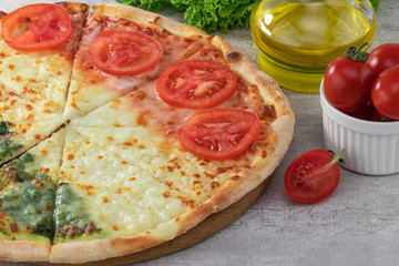 pizza Italian with pesto and tomato on wooden background
