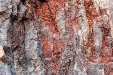 Red orange abstract background. Toned mountains texture, volcanic basalt as in Iceland. Lush lava...