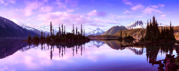 Garibaldi Lake during a colorful morning sunrise. Cloudy Sky Composite. Panoramic Canadian Mountain Landscape. Located near Whistler, Squamish and Vancouver, BC, Canada.