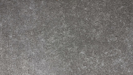 Fototapeta na wymiar Background texture of rough gray asphalt
