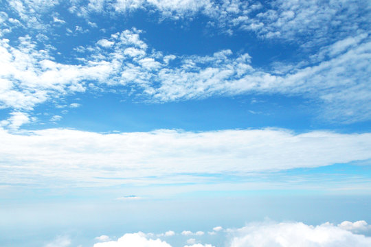 blue sky background with tiny clouds