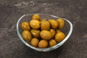 Green pickled olives in the bowl