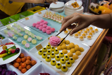Traditional Thai pretty little desserts shaped into mini Thai fruits, vegetables like mangos, chilis and mangosteens. Thai name is Luk Chub, it is made of steamed mung beans