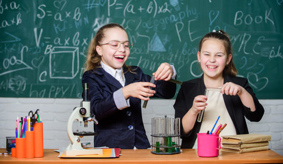 Chemistry research. Biology lesson. Little girls in school lab. Chemistry education. science...