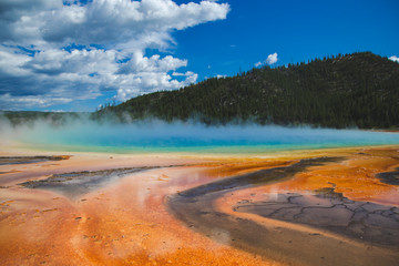 Grand prismatic spring in Yellowstone national park, United States of America. Memory card from vacation, travel background, Wyoming nature landscape,  colorful geyser. World famous landmarks. 