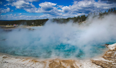 Turquoise hot spring in Yellowstone National park, United States, Wyoming. Geothermal landmark with blue shade of water and steam. Travel background as for memory card from vacation. 