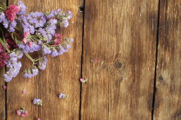 purple flowers on wooden background
