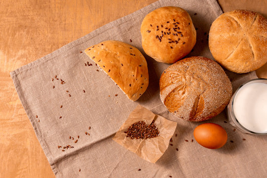 Homemade bread and agg on the wooden table. with copy space for text
