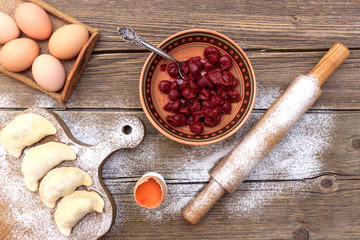 Cherry sponge cake after baking in tin with towel
