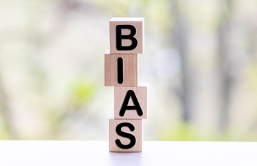 Bias - word from wooden blocks with letters, personal opinions prejudice bias concept, random...
