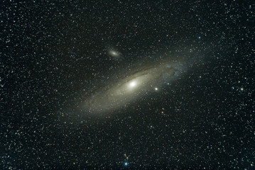 The Andromeda Galaxy , also known as Messier 31, and originally the Andromeda Nebula is a barred spiral galaxy, nearest to the Milky Way. The constellation of Andromeda. High ISO long time exposure