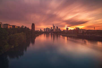 Fototapeta na wymiar Frankfurt am Main city in the setting sun with reflection in the river