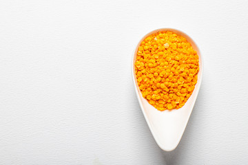 Green peas, beautifully laid out on a white background. in a cup. Top view. copy space.. Vegetarian food.