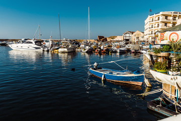 Fototapeta na wymiar beautiful greek bay with a boat on the water