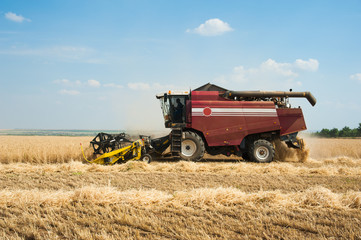 Combine harvesters in a field of wheat