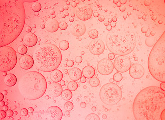 Closeup beautiful liquid bubble on surface colorful background