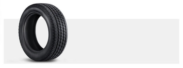 car tire on a grey background