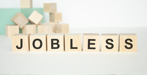The word JOBLESS written on wooden cubes isolated on a light background