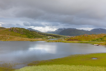 End of fjord. Beautiful Norwegian landscape. view of the fjords. Norway ideal fjord reflection in clear water In cloudy weather. selective focus