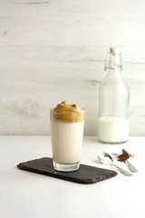 Dalgona coffee. Trendy korean cold drink with foam and milk