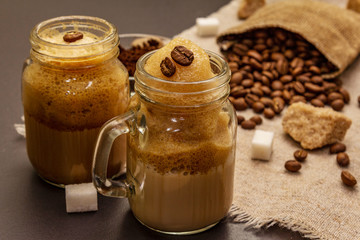 Dalgona coffee in mason jar. Korean fluffy whipped coffee beverage