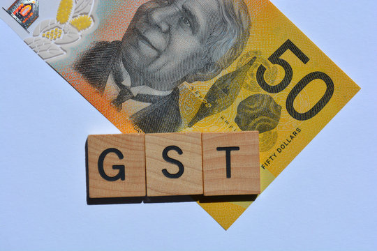 Australia Banknote And The Acronym  For Goods And Services Tax, GST