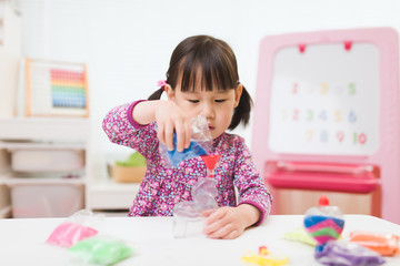 toddler girl making sand animal crafts for homeschooling