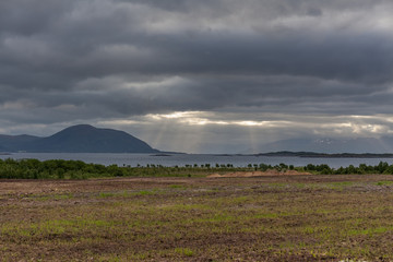 End of fjord. Beautiful Norwegian landscape. view of the fjords. Norway ideal fjord reflection in clear water In cloudy weather. selective focus