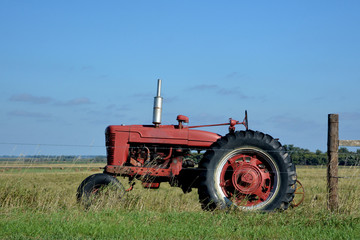 Red Farm Tractor in Field