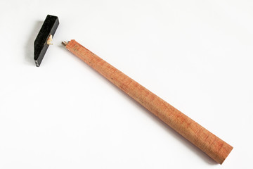 Old hammer and a broken handle on a white background. Typical fracture site