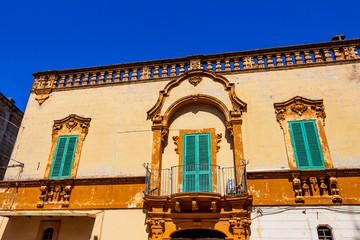Old architecture in Fasano, Province of Brindisi, Apulia, Italy, architectural high section street...