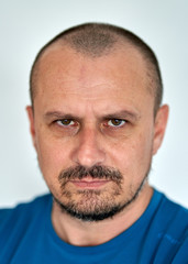 Obraz premium Bearded man with hostile expression