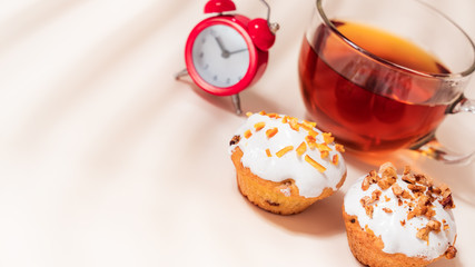 Dessert tea with Muffins on light table. Close up, Copy space.