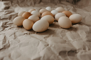 Many dirty eggs on craft paper background