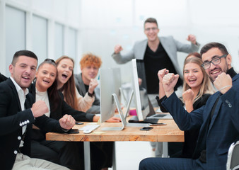 project Manager and working group showing gesture of their success.