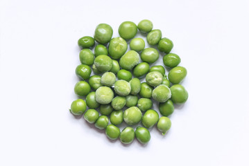 Group of green peas on a white background, isolated, above vantage point photography