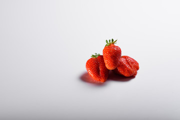 Fresh organic strawberries isolated on a white background. Delivery of natural products. Packaging made from organic strawberries.