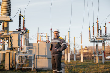 The energy engineer inspects the equipment of the substation. Power engineering. Industry