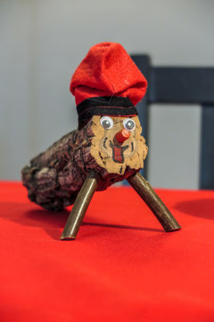 Wooden toy, Ti&oacute; de Nadal, on table with red towel, Barcelona, Spain