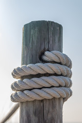 White rope around wooden post