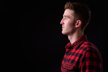 Closeup profile view of young handsome hipster man