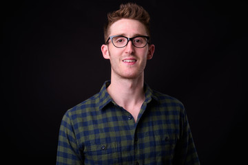Portrait of young handsome hipster man with eyeglasses
