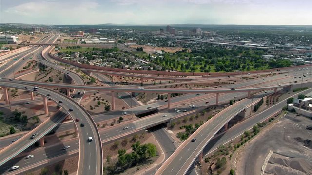 Aerial: Traffic on a busy freeway interchange of Interstate 25 & Interstate 40. Albuquerque, New Mexico, USA