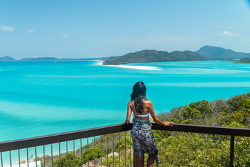 Woman Tourist at beach ocean view,. Whitehaven Whitsundays. Turquoise ocean, white sand. Dramatic DRONE view from above. Travel, holiday, vacation, paradise. Shot in Hill Inlet, Queenstown, Australia.