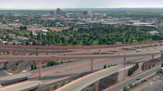 Aerial: Traffic on a busy freeway interchange of Interstate 25 & Interstate 40. Albuquerque, New Mexico, USA