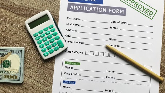 Mortgage application form on a wooden table