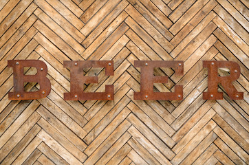 The inscription "Beer" on a wooden background. Old vintage "Beer" sign