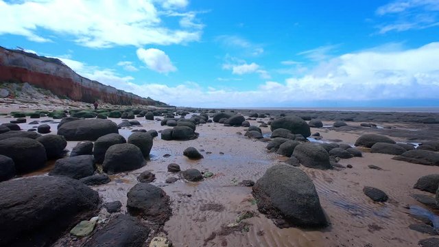 Walking on Rocky beach at Old Hunstanton, Norfolk, UK